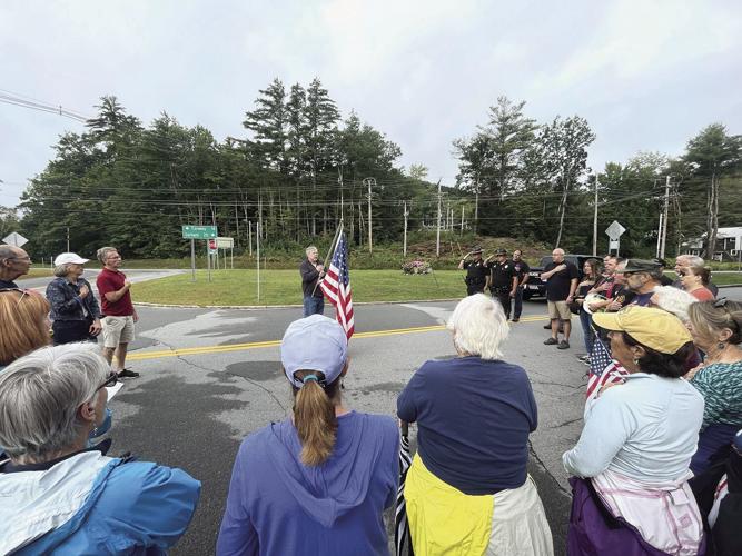 Jackson 9-11 Memorial gathered around flag