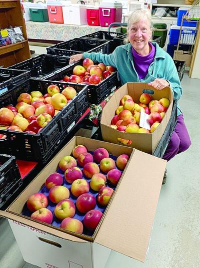 CL w41 pantry donation Miriam with apples cropped.tif