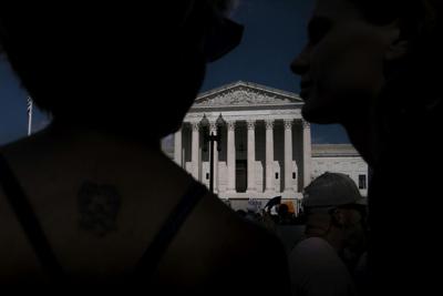 People gather in front of the Supreme Court building following the Dobbs v. Jackson Women's Health Organization ruling on June 24, 2022, in Washington, D.C.