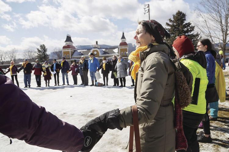 03-19-22 Ukraine Vigil holding hands medium