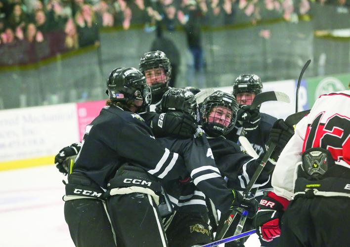 03-11-26 KHS-BG Frozen Four howland goal hug 1