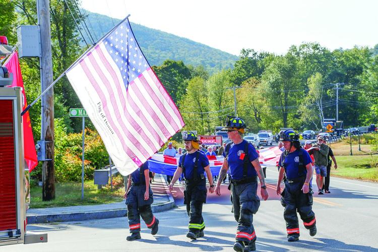 09-11-25 Jackson 911 Walk firefighters leading flag