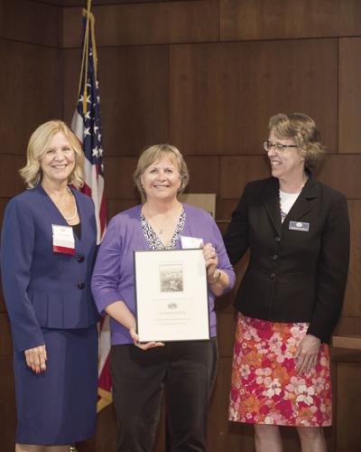 heidi field accepting award