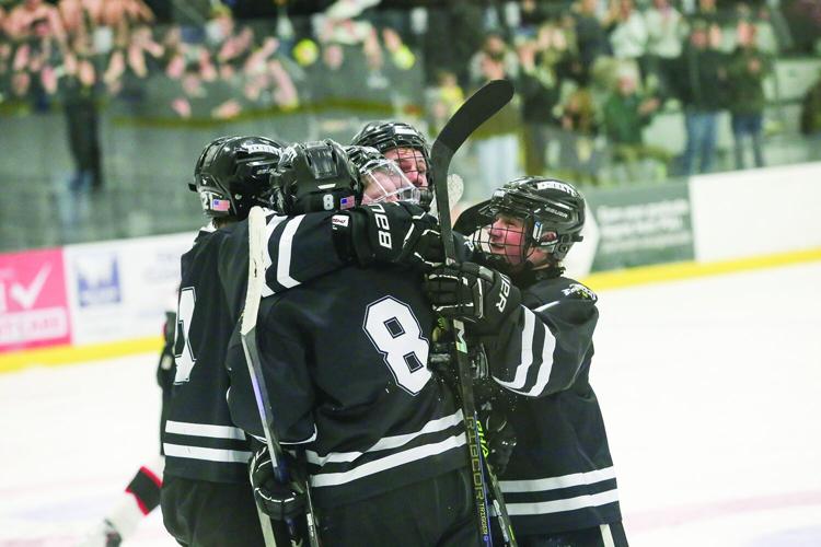 03-11-26 KHS-BG Frozen Four howland goal hug 2