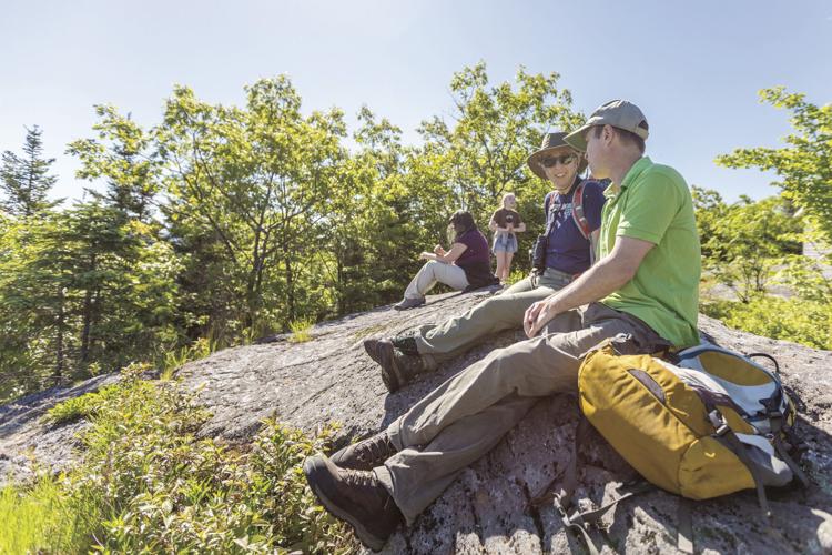 Dundee Monkman hikers sitting