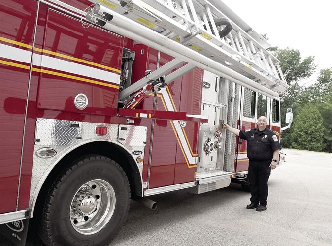 New Bartlett Fire Engine - Chief Currier lowering ladders