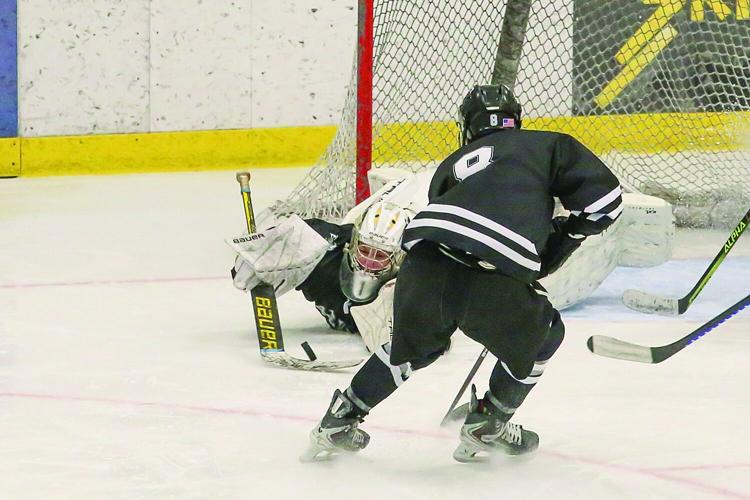 03-11-26 KHS-BG Frozen Four laughland diving save 2