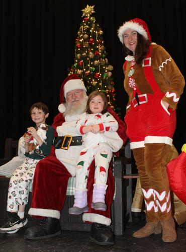 Christopher Santy with his sister Ella Santy, and Santa’s Elf, mother Bridgette Santy