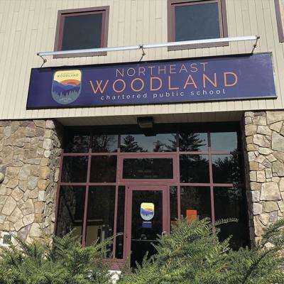 Northeast Woodland Chartered Public School sign