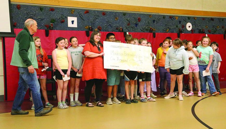 05-28-26 Madison Maple Award holding check wide