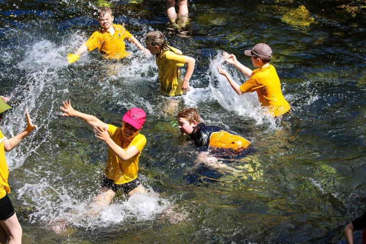 Primary school avoids heatwave closure by teaching pupils down by a stream