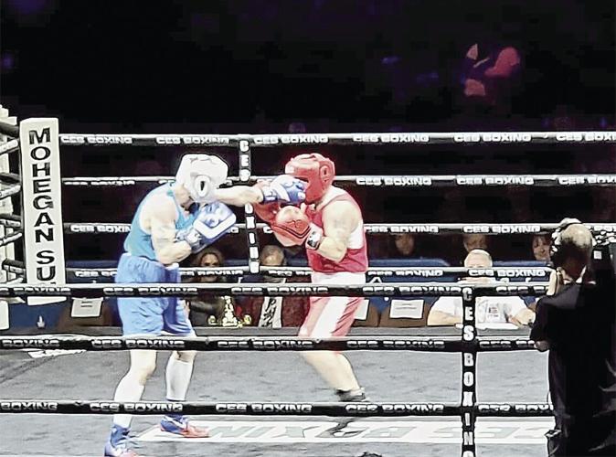 Boxing - Elwood McLlarky lands a jab