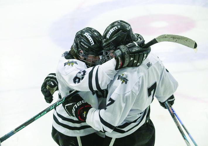 02-28-26 KHS Hockey seniors hug wrapped