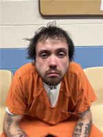 Dalton man faces numerous charges by police at home fire site