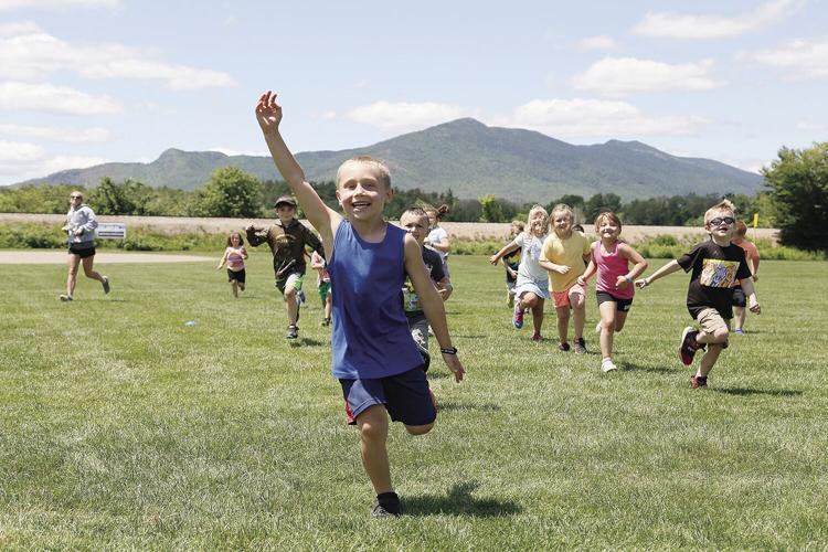 06-23-21 Summer Camp running through field medium