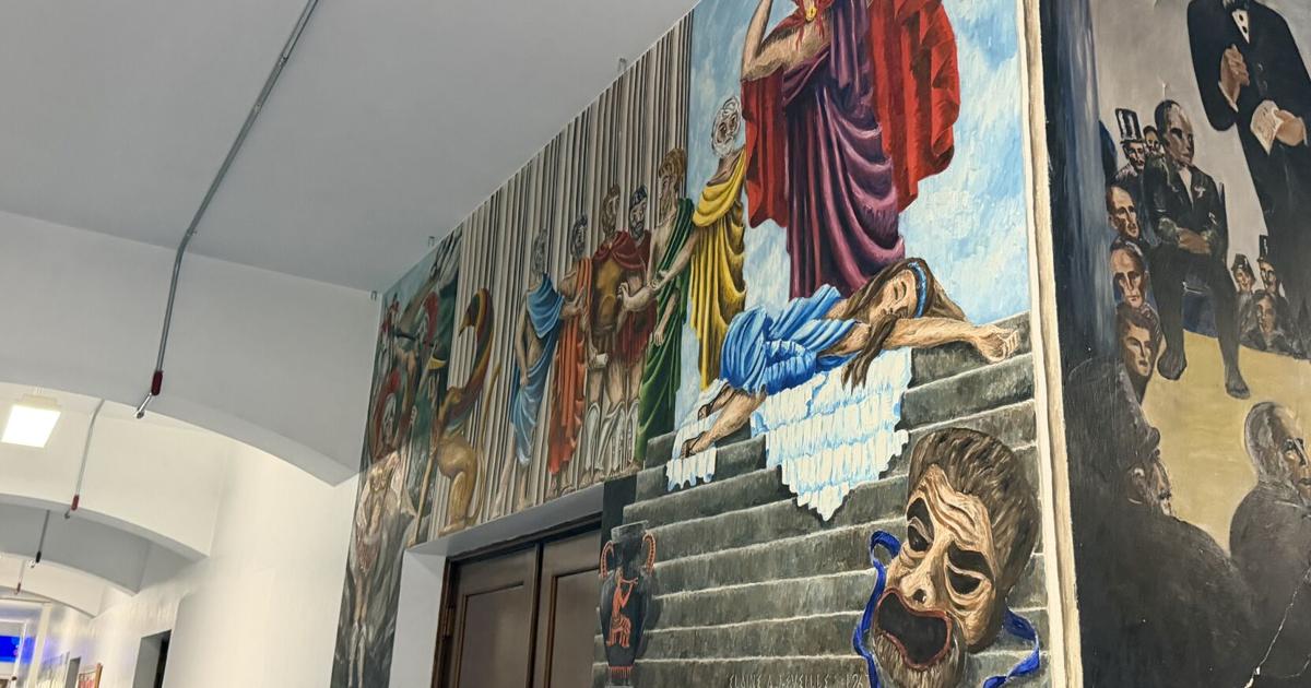 School officials plan to paint over old murals