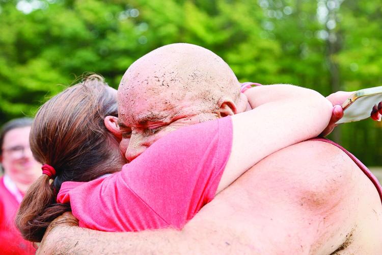 09-07-25 Mud Bowl hug after win tight
