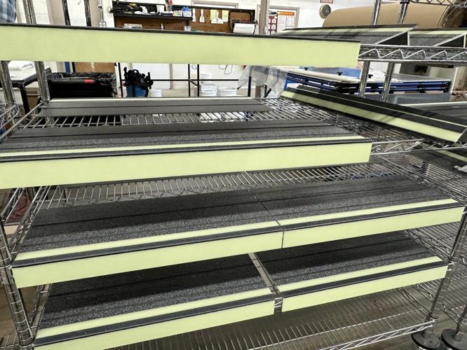 Placed horizontally on shelves at Baultar Manufacturing in Berlin are steps