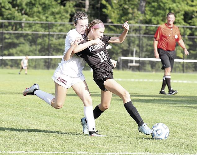 KHS Girls Soccer - Adelyn McAllister draped by a defender