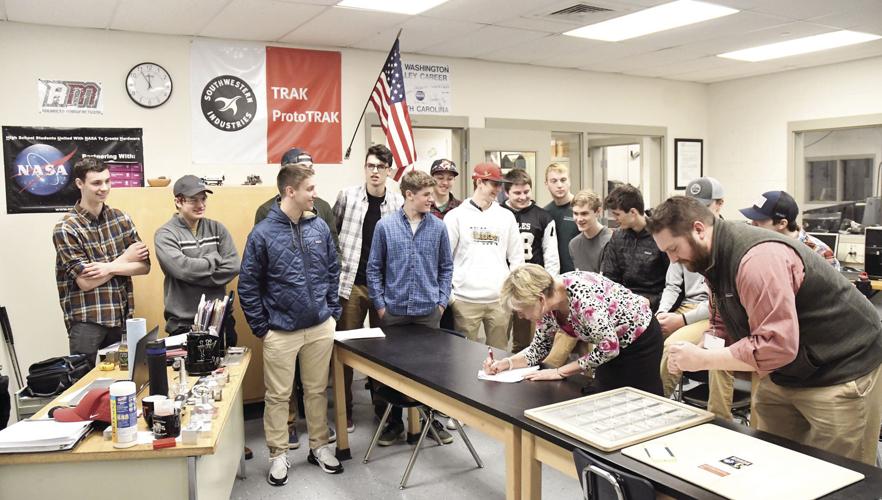 NASA HUNCH - Kevin Carpenter and Virginia Schrader sign locker