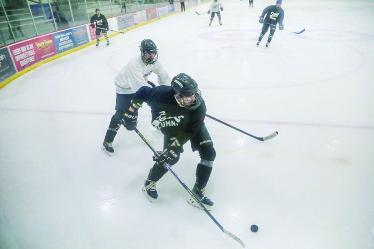 11-29-25 Kennett Hockey Alum carrying above