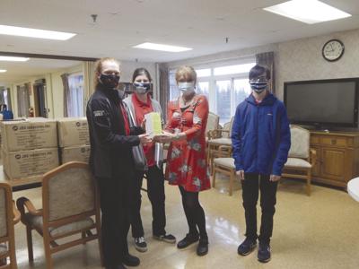 Students provide a special gift to honor area workers