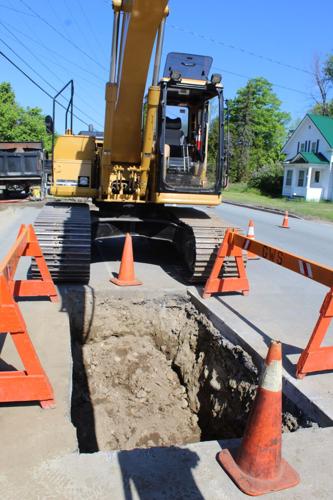 Beneath Dublin Street in Gorham on May 26, a water shut off trench is prepared