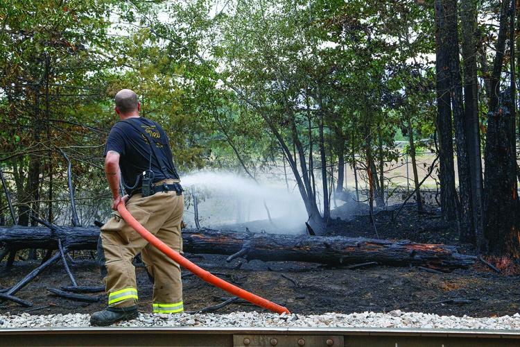 08-13-25 Holiday Inn-Brush Fire brush hosing behind 2