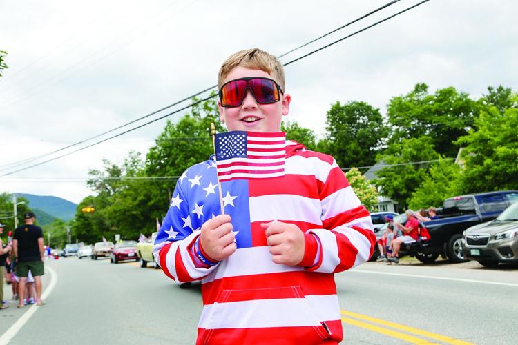 07-04-25 Fourth Parade bartlett smile with flag