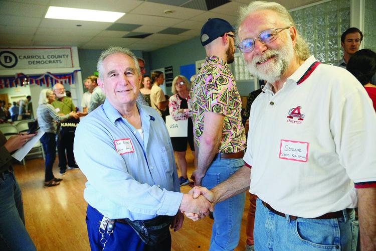 08-14-24 CC Dems Office buco woodcock handshake