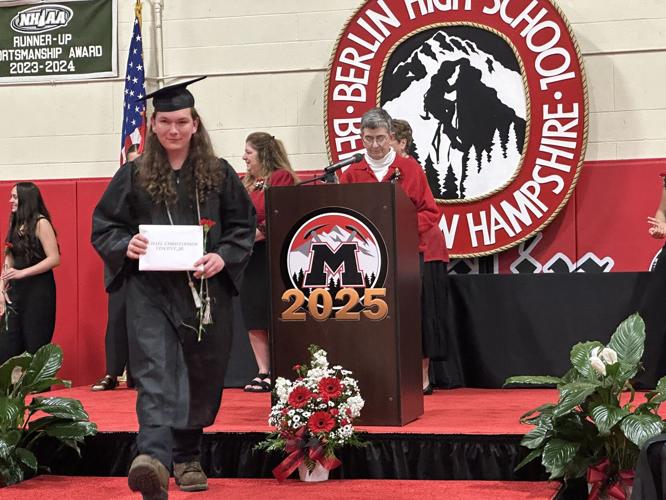 Michael Vincent Jr. steps from the stage with his Berlin High School diploma