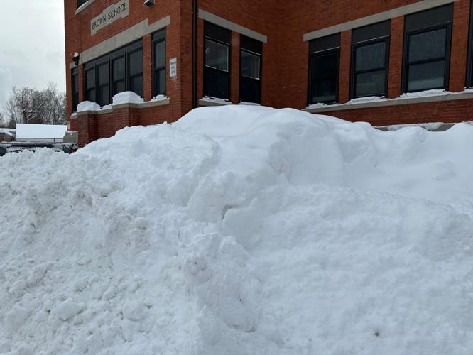 A familiar site around the city --- snow piles