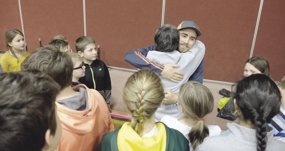 4-24-18 Doherty visits Pine Tree_student hug