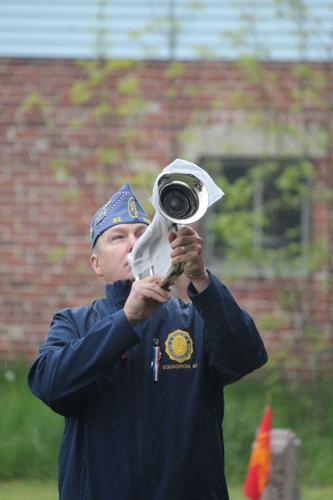 Steve Roy, commander of the American Legion in Gorham plays “Taps”