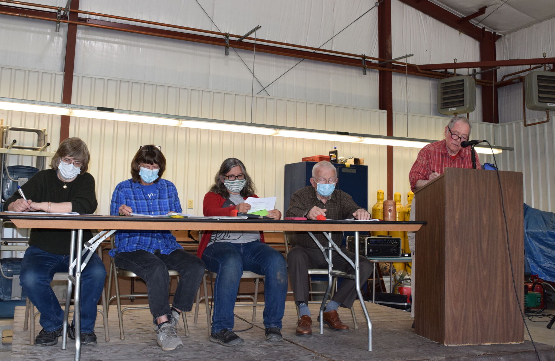 Randolph holds hour-long town meeting in its garage