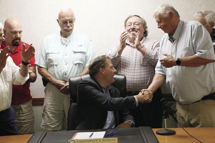 07-22-22 Sununu Bill Signing shaking hands tighter