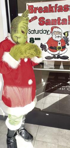 Grinch with BWS sign.jpg