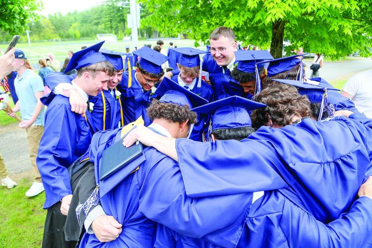 05-24-25 FA Graduation football huddle