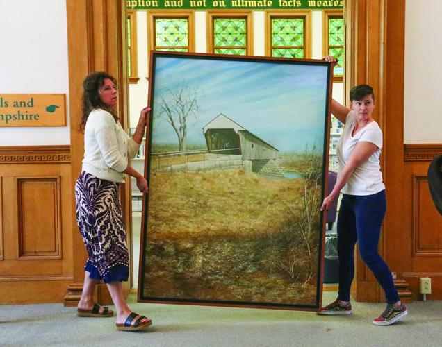 09-15-25 Library Hanging Paintings carrying square