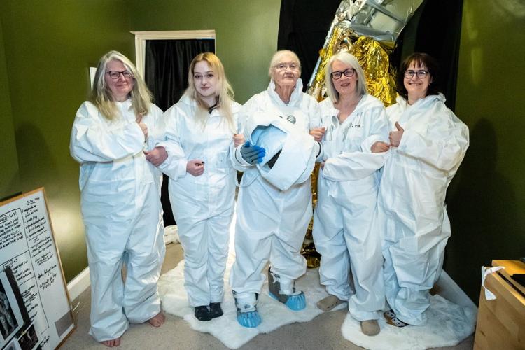 Artist helps first women to walk on the moon – by turning her front room into the lunar surface filed with moon rock.