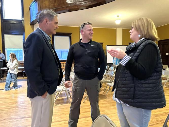 Former City Manager James Wheeler, Mayor Robert Cone, planner Pamela Laflamme
