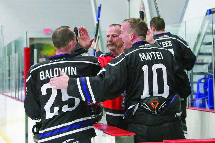 03-23-26 Battle Badges Hockey chief high-fives