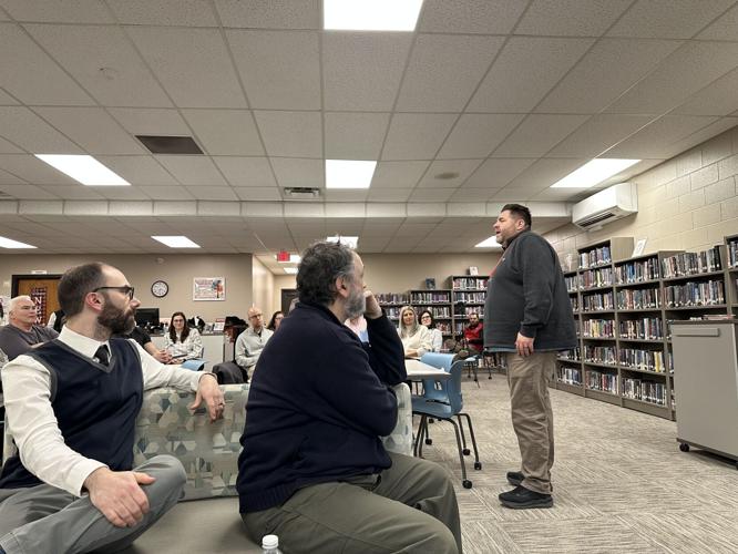 Berlin Middle High School Principal Andy Rancloes (standing) speaks about new graduation requirements