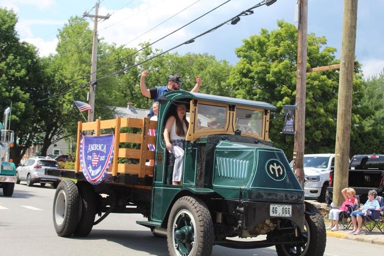 Older vehicles such as this mighty truck made their way down Main Street