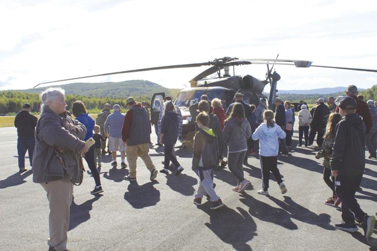 Milan schoolchildren and residents view helicopter