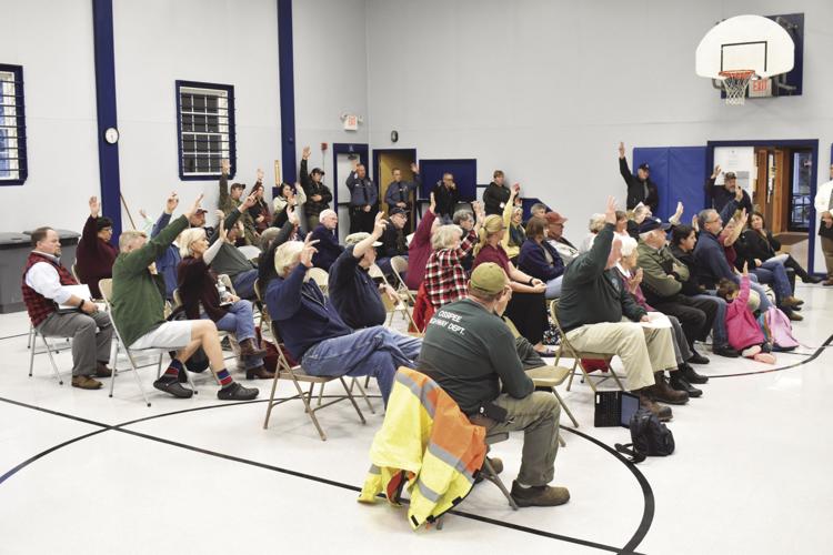 ossipee residents raise hands.jpg