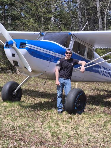 Zack Bishop, of Colebrook, stands by his 1948 Cessna 170