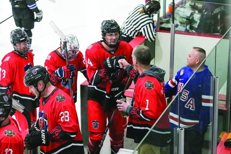 03-23-26 Battle Badges Hockey goal fist bumps 2