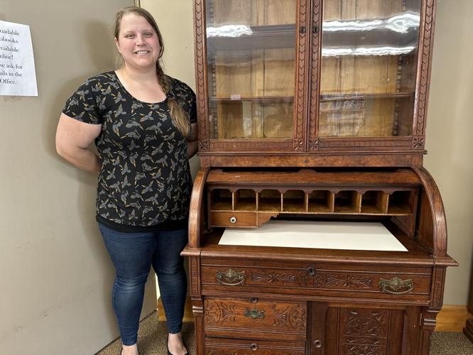 Shannon Buteau, director of the Gorham Public Library, reveals the interior of the desk