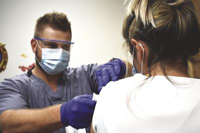 Memorial Hospital's Vaccination Program Manager Zach Sevigny,